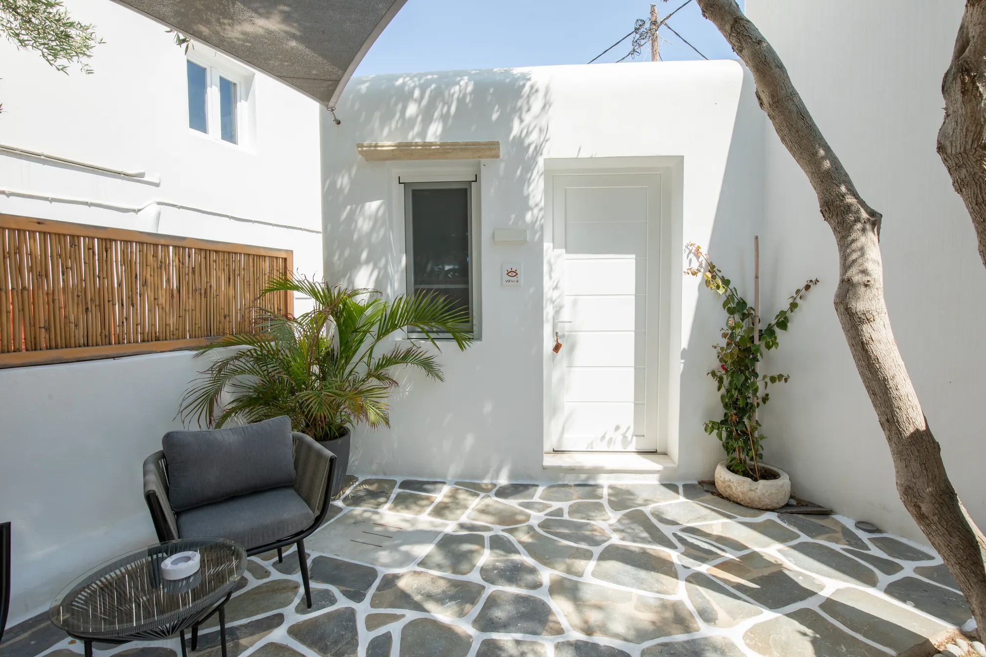 Shaded courtyard with lounge chairs outside the suite